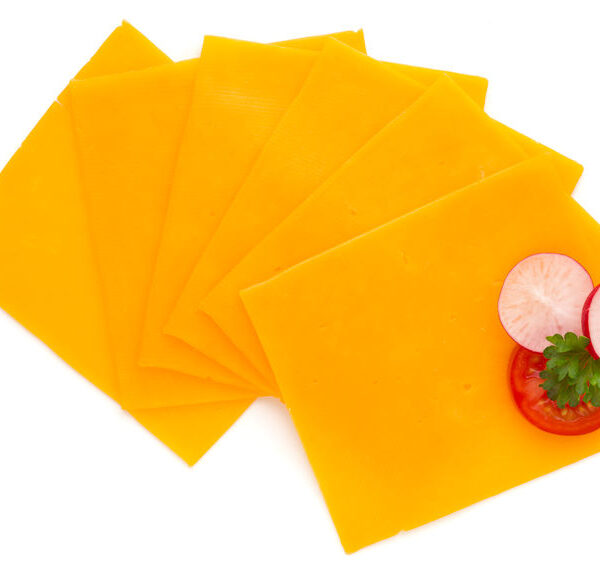 Cheddar cheese slice isolated on the white background.