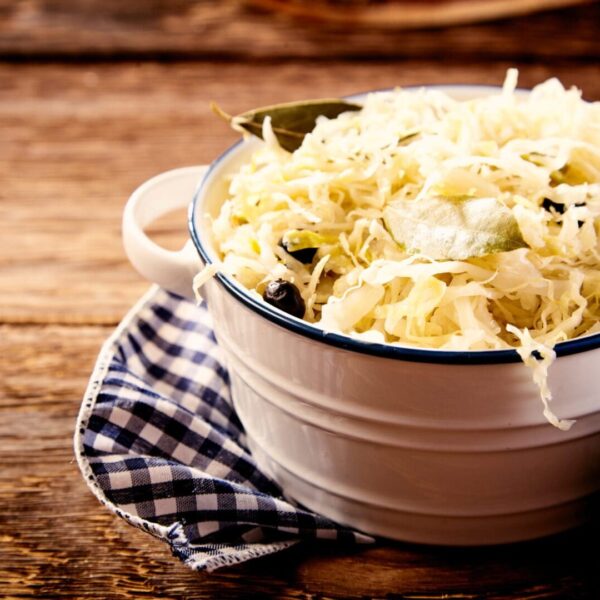 Bowl of sauerkraut in close up on wooden table